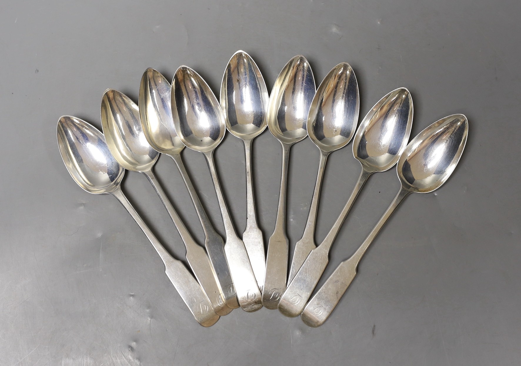 A matched set of nine George III and later Scottish silver dessert spoons, including Edinburgh, 1810(5) and 1839 (3), 8.4oz.